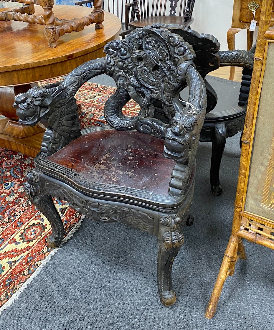 A pair of early 20th century Chinese carved elbow chairs, width 64cm, depth 46cm, height 83cm